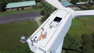 Drone catches man sunbathing on wind turbine in Rhode Island, US