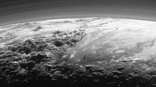 Pluto's Majestic Mountains, Frozen Plains and Foggy Hazes