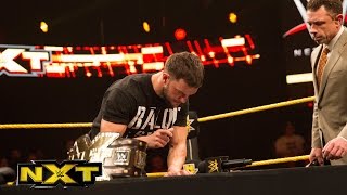 Finn Balor and Samoa Joe sign the contract for TakeOver: London: WWE NXT, Nov. 25, 2015