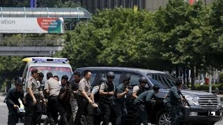 Over six killed in multiple blasts in Jakarta, gunmen holed up