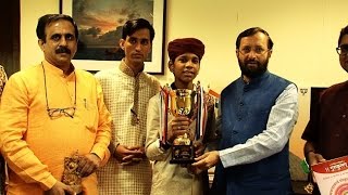 Javadekar greets Tushar after he bags grand champion title in Arithmetic Competition