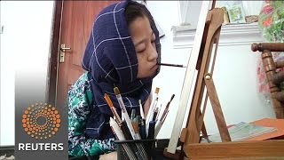 Disabled teen in Kabul sketches with her mouth