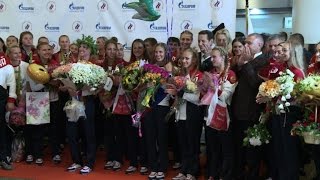 Russian athletes welcomed home in Moscow
