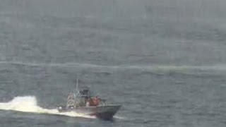 Raw: Video Shows Iranian Boats Near US Ship