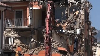 Raw: Quake-Ravaged Buildings in Italy Demolished