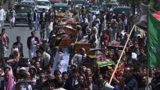 Tensions flare as Afghans seek to rebury 'bandit king'