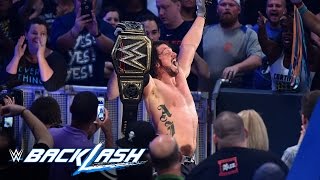 AJ Styles raises his hands high as the new WWE World Champion: Backlash 2016