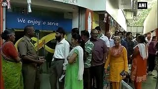 People throng banks to exchange notes