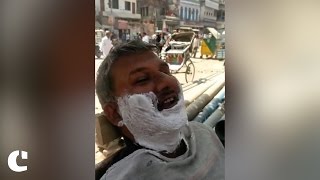 This barber and his customer have their preferences sorted for UP Elections