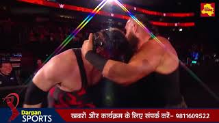 Braun Strowman crushes Kane underneath the announce team stage
