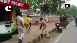 Clash erupts between two groups, police baton charge students