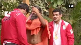 Wrestlers Sushil Kumar and Sumit Malik meet Baba Ramdev