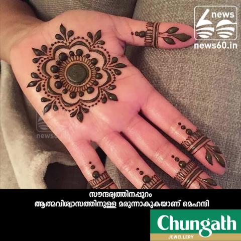 Henna designs on head of cancer patients