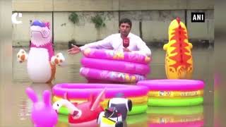 Lahore reporter floats around in kid’s pool to draw local govt’s attention on water logging