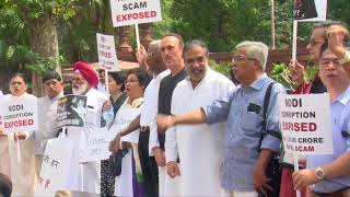 Opposition parties hold a protest outside Parliament over Rafale deal Scam