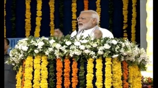 PM witnesses collective e-Gruhpravesh of PMAY-G beneficiaries, addresses public meeting in Valsad