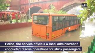 Bus gets stuck under waterlogged bridge in Delhi’s Yamuna Bazar area