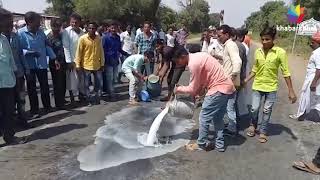 Agitated cattle breeders spill milk on road in Banaskantha