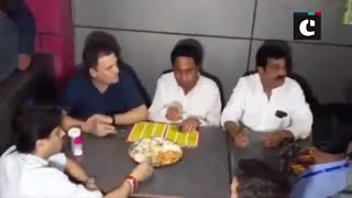 Rahul Gandhi enjoys refreshment at a roadside eatery