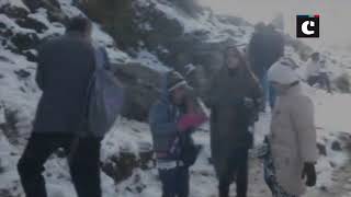 Tourists enjoy season's first snowfall in Kufri
