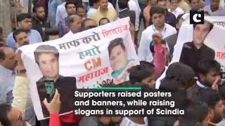 Supporters hold banners in Bhopal to support Jyotiraditya Scindia