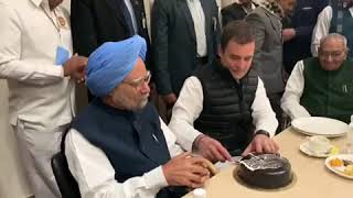 Former PM Manmohan Singh and Congress President Rahul Gandhi cut a cake on Congress Foundation Day
