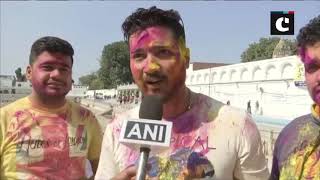 People celebrate Holi at Durgiana Temple in Amritsar