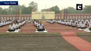 BSF personnel perform yoga at Chawala camp in Delhi