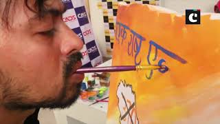 Specially-abled artist supports revocation of Article 370 by showcasing his art