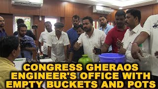 Congress gheraos engineer's office with empty buckets and pots