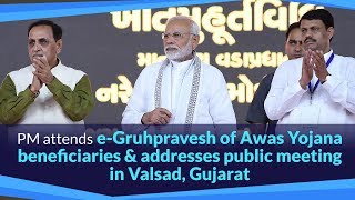 PM attends e-Gruhpravesh of Awas Yojana beneficiaries & addresses public meeting in Valsad, Gujarat