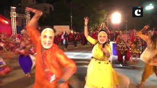People wear PM Modi masks while performing garba in Gujarat’s Surat
