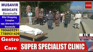 Funeral prayers of a 70 year old lady in Sopore who died of #COVID-19 in SDH Sopore on May 1,2021.