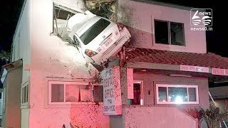 Car flies through air, wedges in upper wall of a two-storey building in California