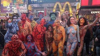 Naked models take over Times Square and pose for photos