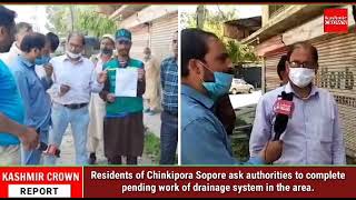Residents of Chinkipora Sopore ask authorities to complete pending work of drainage system in the