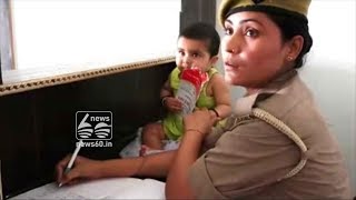Jhansi's mom cop at work with 6 month old baby