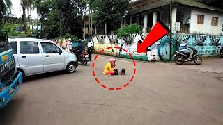 Woman sitting in the middle of road. Demands action against husband for making her video viral