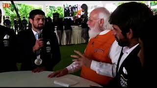 PM Modi conversates with silver medalist Ravi Dahiya and asks him about his last bout in detail