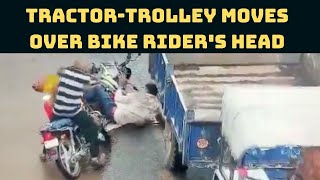 Tractor-Trolley Moves Over Bike Rider's Head; Spine-Chilling Video Goes Viral | Catch News