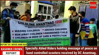 Specially Abled Riders holding message of peace on hand controlled scooters received by DC Anantnag.