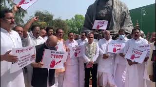Cong MPs protesting against the petro hike at Gandhi statue in Parliament House
