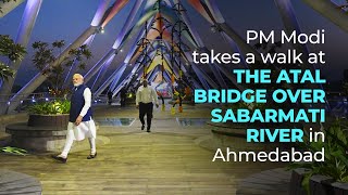 PM Modi takes a walk at the Atal Bridge over Sabarmati River in Ahmedabad