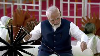 PM Shri Narendra Modi spins the charkha at the Khadi Utsav at Sabarmati Riverfront in Ahmedabad.