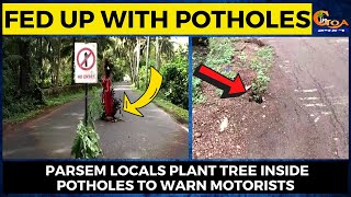 Fed up with potholes, Parsem locals plant tree inside potholes to warn motorists