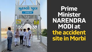Prime Minister Narendra Modi at the accident site in Morbi l PMO