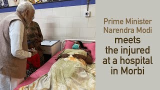 Prime Minister Narendra Modi meets the injured at a hospital in Morbi l PMO