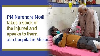 PM Narendra Modi takes a stock of the injured and speaks to them, at a hospital in Morbi l PMO