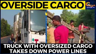 Trailer truck with oversized cargo gets tangled in the over head power line, breaks electricity pole