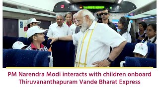 PM Narendra Modi interacts with children onboard Thiruvananthapuram Vande Bharat Express